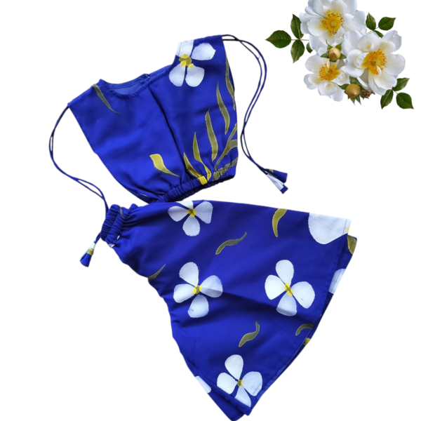 “Girls’ blue co-ord set with hand-painted white and yellow floral print – sleeveless top and flared shorts”